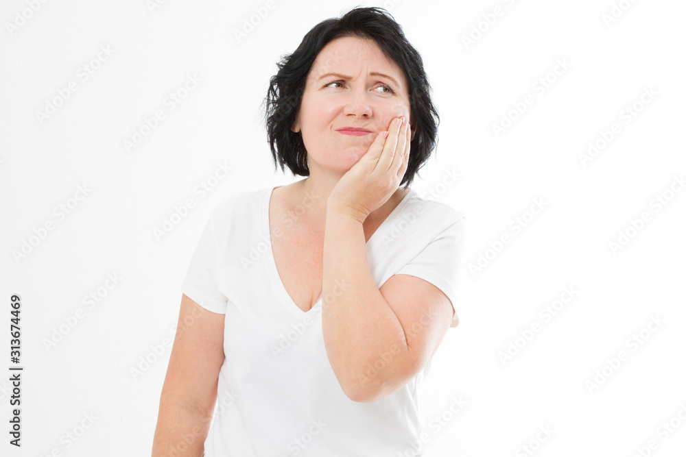 Attractive woman in her 40s pressing her bruised cheek with a painful expression as if she's having a terrible tooth ache. Middle age woman with toothache copy space Attractive woman in her 40s pressing her bruised cheek with a painful expression as if she's having a terrible tooth ache. Middle age woman with toothache copy space