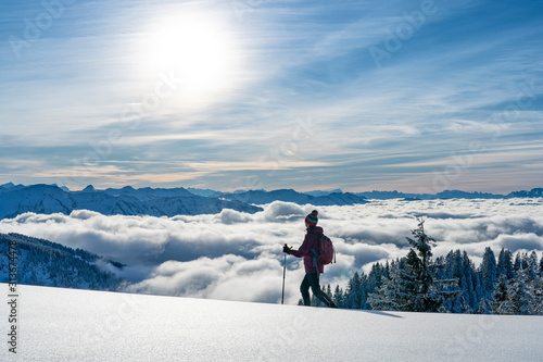 nice senior woman snowshoei...