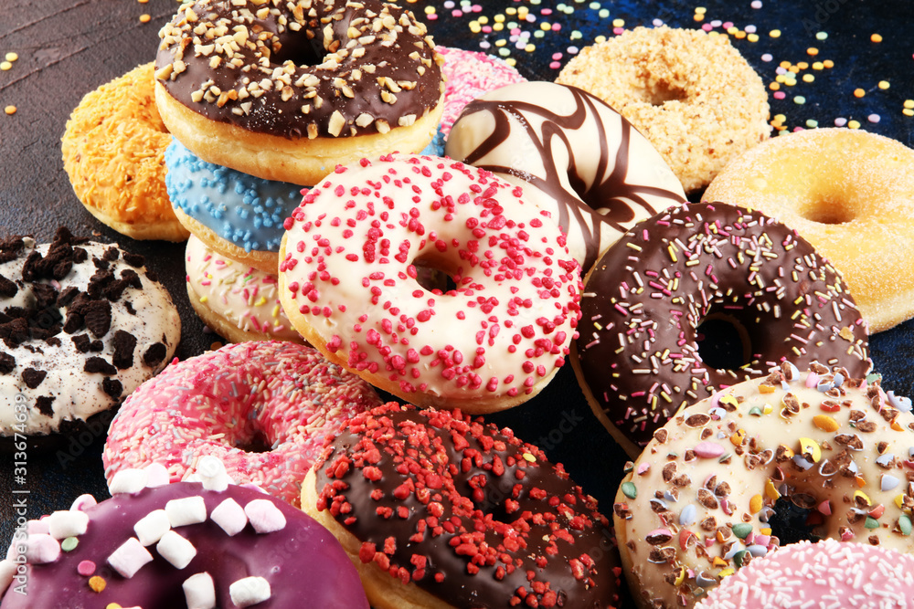 assorted donuts with chocolate frosted, pink glazed and sprinkles donuts assorted donuts with chocolate frosted, pink glazed and sprinkles donuts