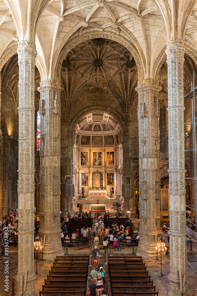 People at the main chapel of the Church of Santa Maria at Mosteiro dos Jeronimos (Jeronimos Monastery) in Belem, Lisbon, Portugal.