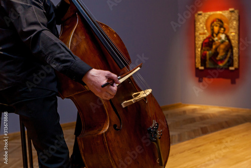 Photography A man playing on a double bass