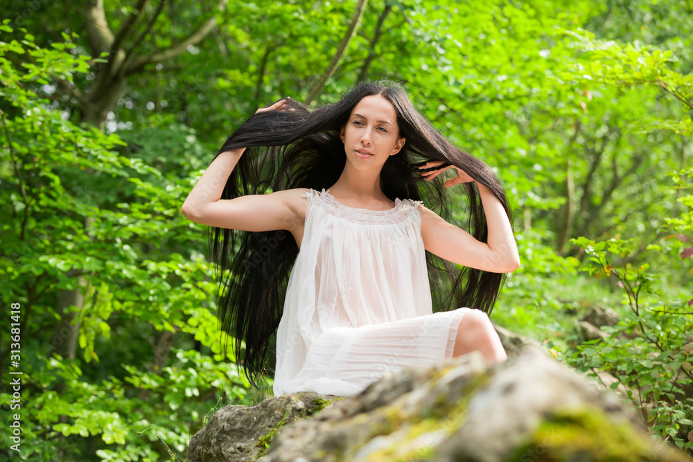 Girl with long black hair in forest. Slavic girl in a white dress.  Ukrainian girl in ethnic dress. Stock Photo | Adobe Stock