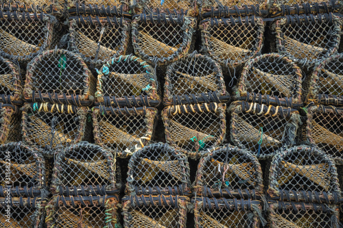 Lobster traps on a pier.