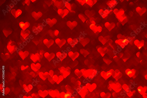 Abstract light, red bokeh pattern in heart shape. St Valentides Day or Holiday concept, background image.