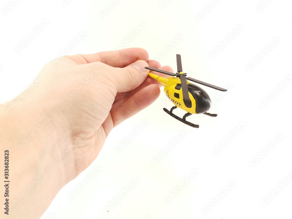 Toy helicopter yellow on white background