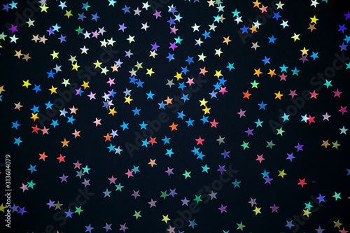 colorful stars on a black background
