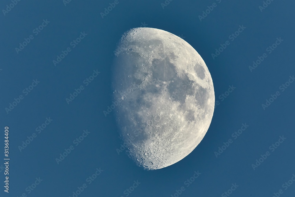 The Moon detailed shot in blue daylight sky, taken at 1600mm focal length, waxing gibbous phase The Moon detailed shot in blue daylight sky, taken at 1600mm focal length, waxing gibbous phase