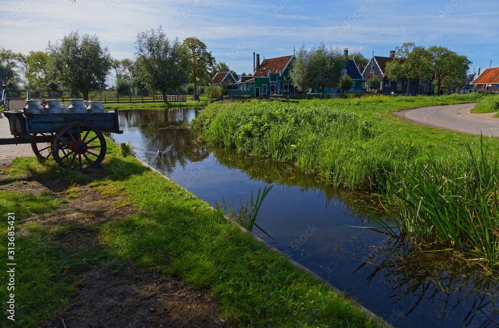 Fototapeta premium Carriage with milk at rural area