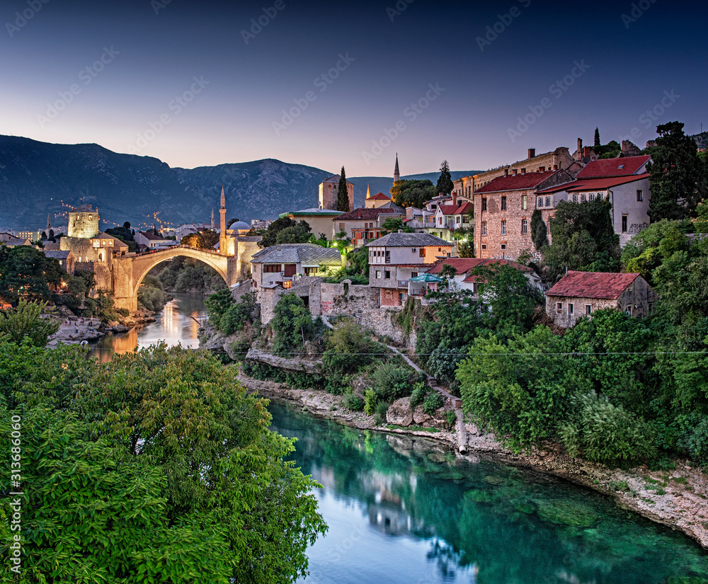 Colorful sunset over the medieval bridge of Mostar 