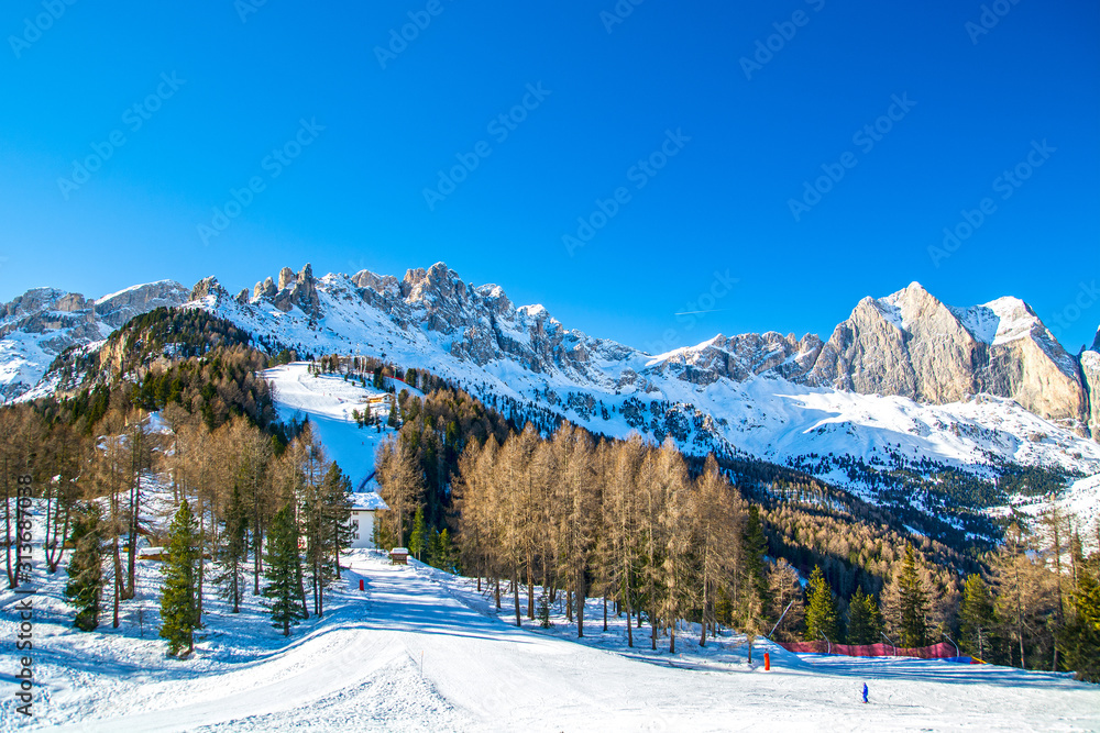 Dolomites mountainski slope in Vigo di Fassa resort, Fassa valley area, Italy