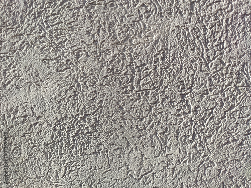 The texture of the plaster is bark beetle on the wall. Seamless texture.
