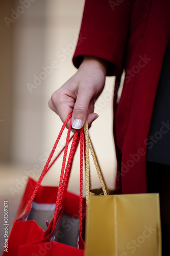  woman with shopping bags in hands
