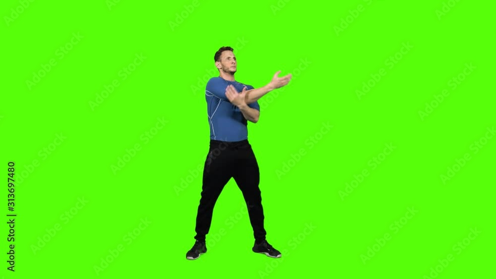 Muscular Man Stretching Before Or After a Workout Over Green Screen, Long Shot. Muscular Man Stretching Before Or After a Workout Over Green Screen, Long Shot.