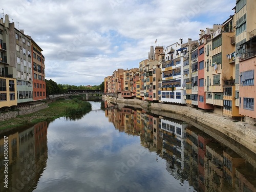 The city on the river  bridge and street of the old town with colofrul houses in summer  Spain.