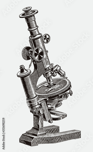 Inclinable optical microscope with revolving stage for mineralogical research. Illustration after antique engraving from 19th century