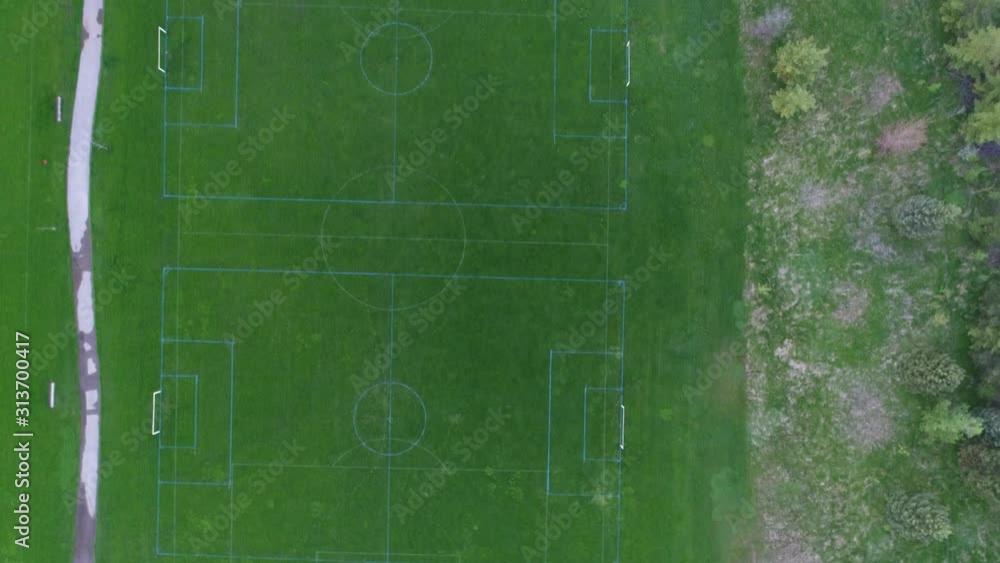Aerial Over Soccer Field In Park Towards Houses Neighborhood Higher End Neighborhood Aerial Over Soccer Field In Park Towards Houses Neighborhood Higher End Neighborhood