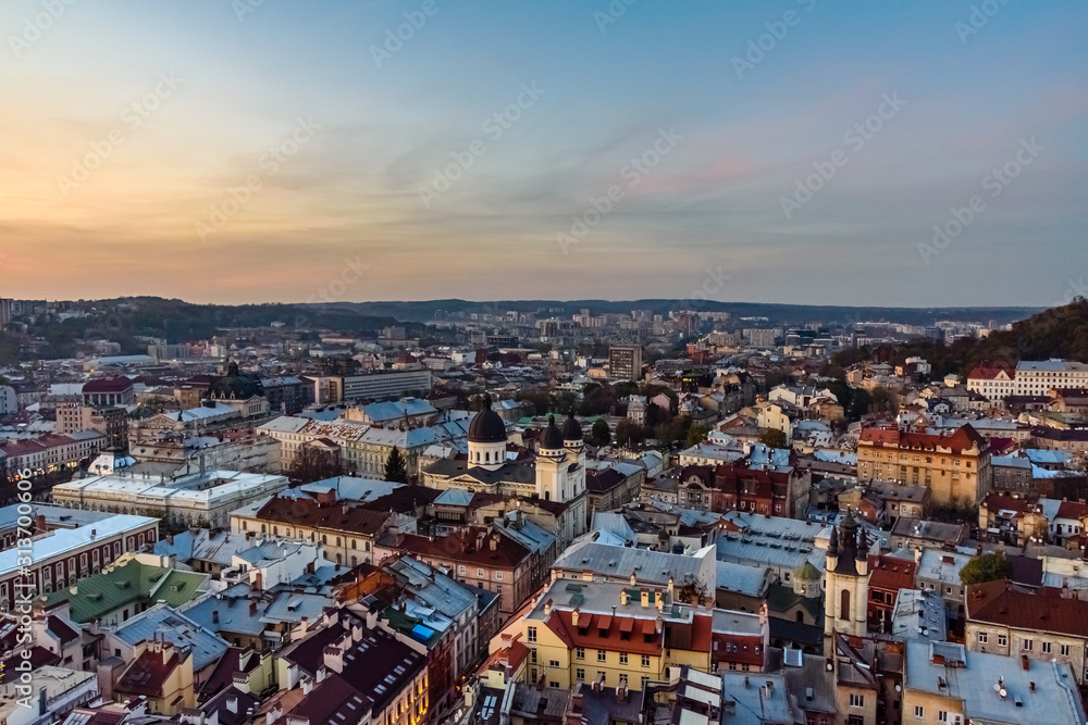 Fototapeta View on historic center of the Lviv at sunset. View on Lvov cityscape from the town hall