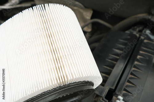 white new fresh Intake air filter, vehicle maintenance, car servicing and repair engine procedure, copy space for text