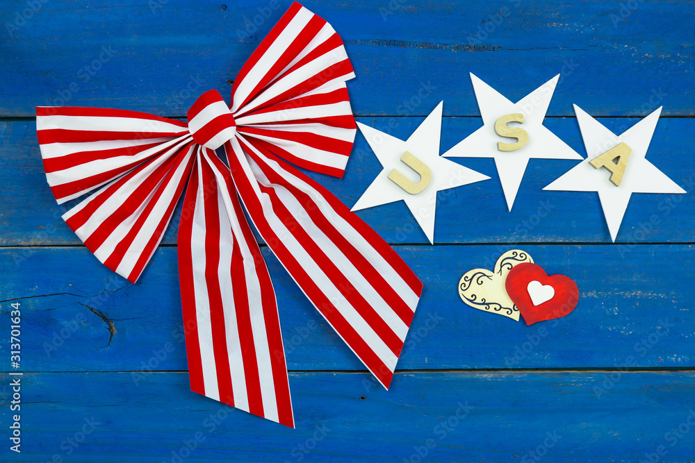 Obraz premium Red and white bow with USA, stars and hearts on background; American design 