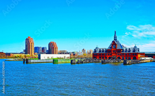 Central Railroad of New Jersey Terminal and Hudson River. View from Manhattan, New York of USA. Skyline and cityscape with skyscrapers at United States of America, NYC, US. American architecture.