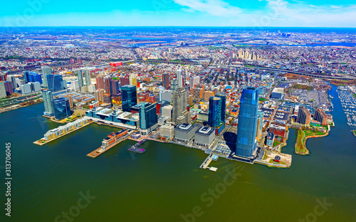 Jersey City, New Jersey and Hudson River. View from Manhattan, New York of USA. Skyline and cityscape with skyscrapers at United States of America, NYC, US. Road and American architecture.