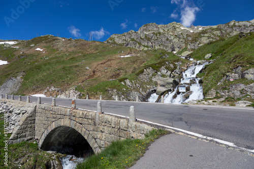 The Furka Pass crosses the icy cold Sidelenbach, Switzerland photo