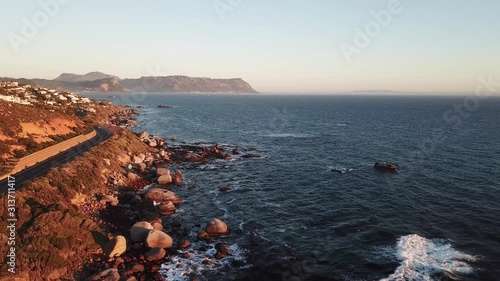 4K sunny summer early morning aerial drone video of Atlantic Ocean boulders coast near Murdock Valley on the outskirts of Simon's Town en route to Cape Of Good Hope, Western Cape, South Africa photo