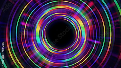 Abstract seamless loop of rainbow colorful rings. Glowing rays emanate from center. 4K 3D motion graphics background for intro, banner, vj, logo