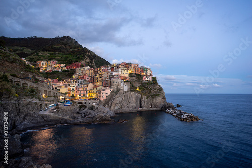 Evening view of the village of Manarola, on the coast of the Cinque Terre in Italy.