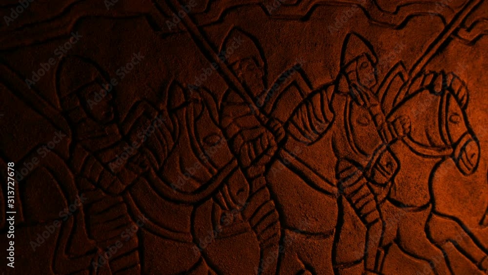 Medieval Soldiers Wall Carving In Fire Glow
