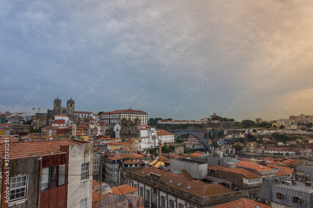 Oporto, Portugal skyline, old buildings, churches and Dom Luis iron bridge in background