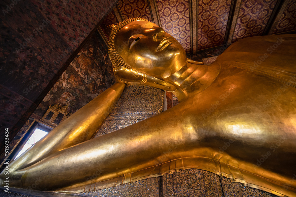 famous golden reclining buddha statue at wat pho bangkok thailand
