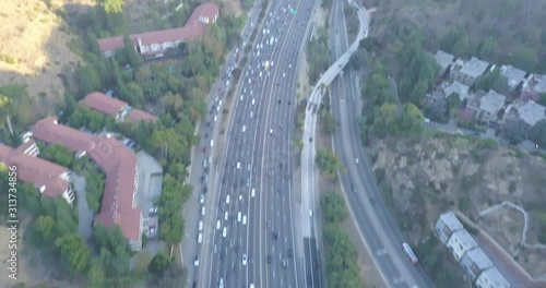 4k Drone Hollywood Hills Los Angeles mountains, blue skies, freeways, reservoir, downtown and hollywood.