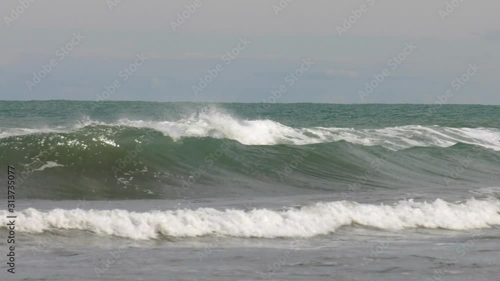 Slow motion waves rolling into shore, mediterranean sea Slow motion waves rolling into shore, mediterranean sea