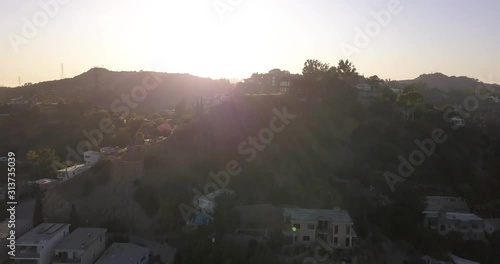 4k Drone Hollywood Hills Los Angeles mountains, blue skies, freeways, reservoir, downtown and hollywood.