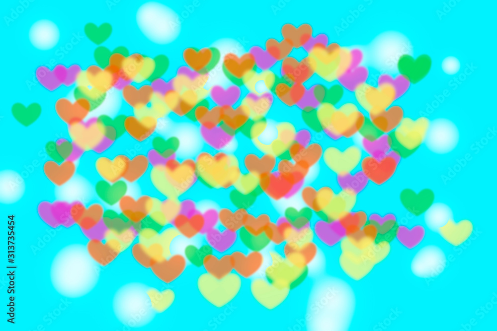 coloful blurry heart shape on gradient pink abstract background