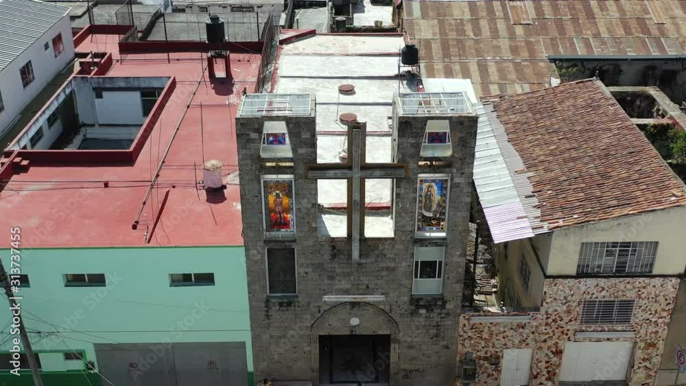 Cross and religious stained glass windows on church Señor del Consuelo in Tepic, Nayarit. Mexico art and culture. Aerial drone view. Cross and religious stained glass windows on church Señor del Consuelo in Tepic, Nayarit. Mexico art and culture. Aerial drone view.