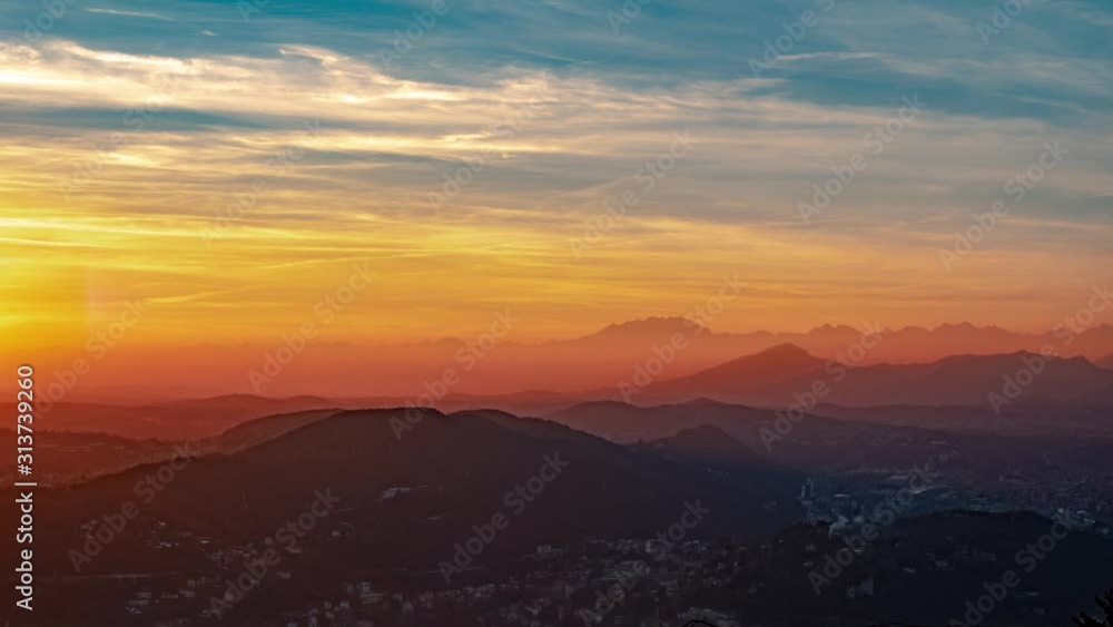 Moving clouds and colorful sky during golden hour just over the beautiful mountains. Static. Timelapse. Moving clouds and colorful sky during golden hour just over the beautiful mountains. Static. Timelapse.