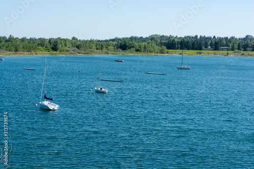 Sailing and dragon boats from a distance on fresh water lake
