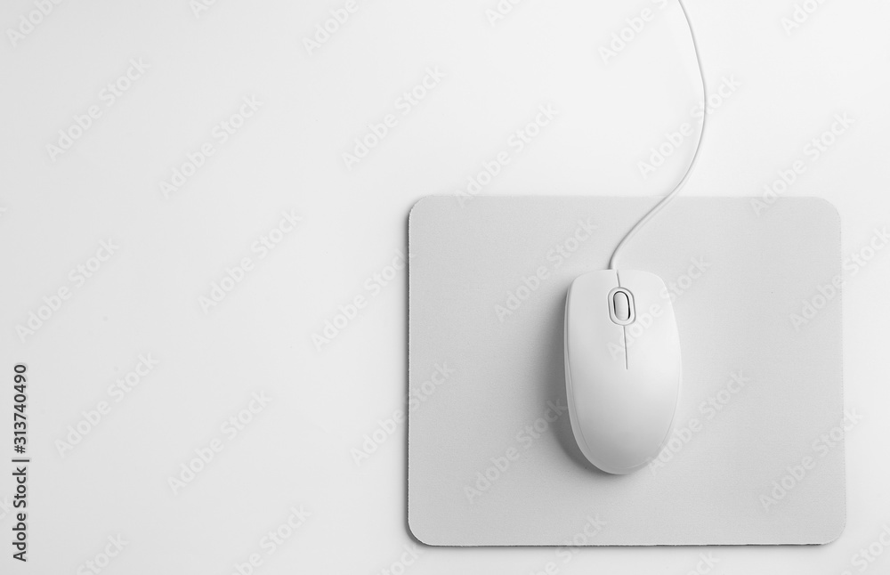 Modern wired optical mouse and pad on white background, top view Stock  Photo | Adobe Stock