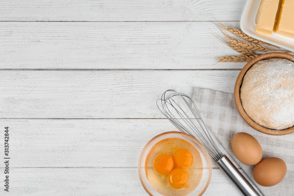 Flat lay composition with eggs and other ingredients on white wooden table, space for text. Baking pie Flat lay composition with eggs and other ingredients on white wooden table, space for text. Baking pie