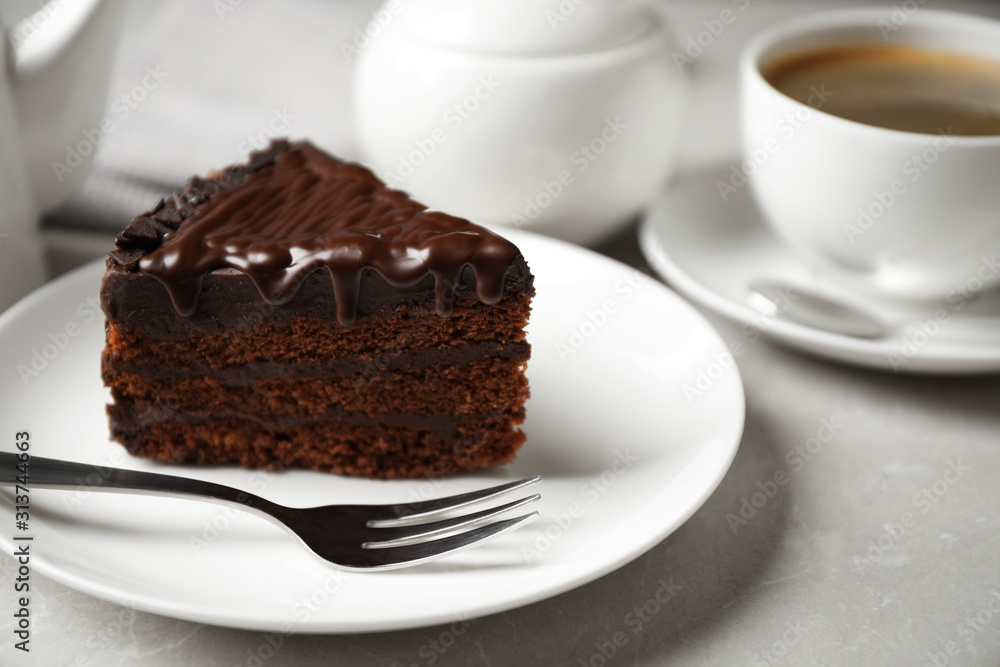 Tasty chocolate cake served on white table, closeup Tasty chocolate cake served on white table, closeup