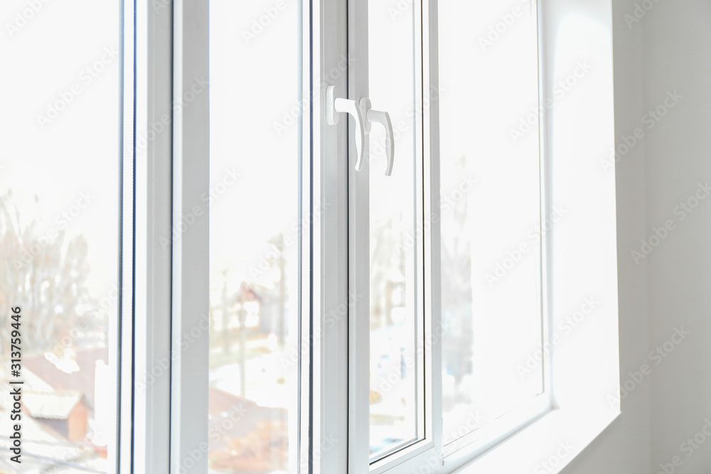 Big modern metal-plastic window in room Big modern metal-plastic window in room