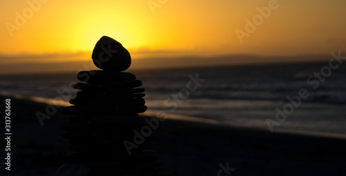 silhouette of rocks at sunset