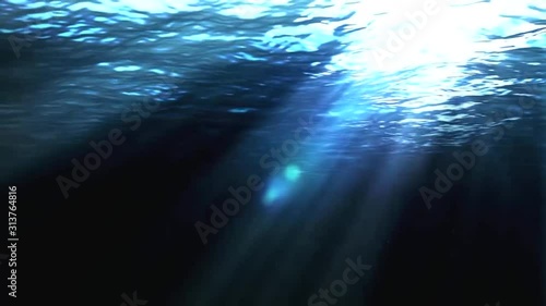 Abstract footage under the sea while the light is shining.