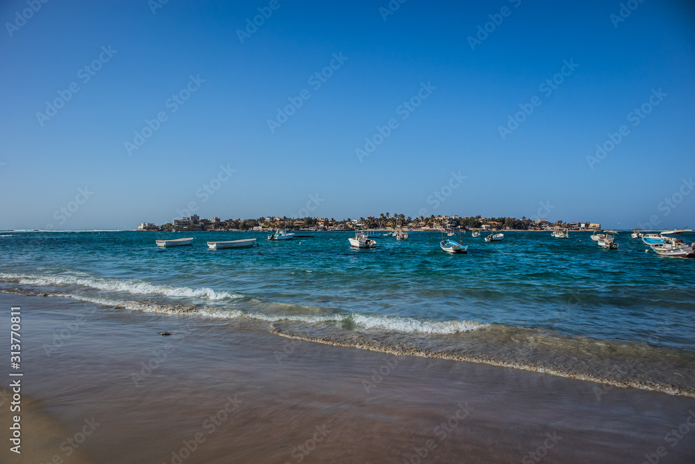Panorama of Ille de Ngor or Ngor island, looking from Yoff beach. The island surrounded by different boats.