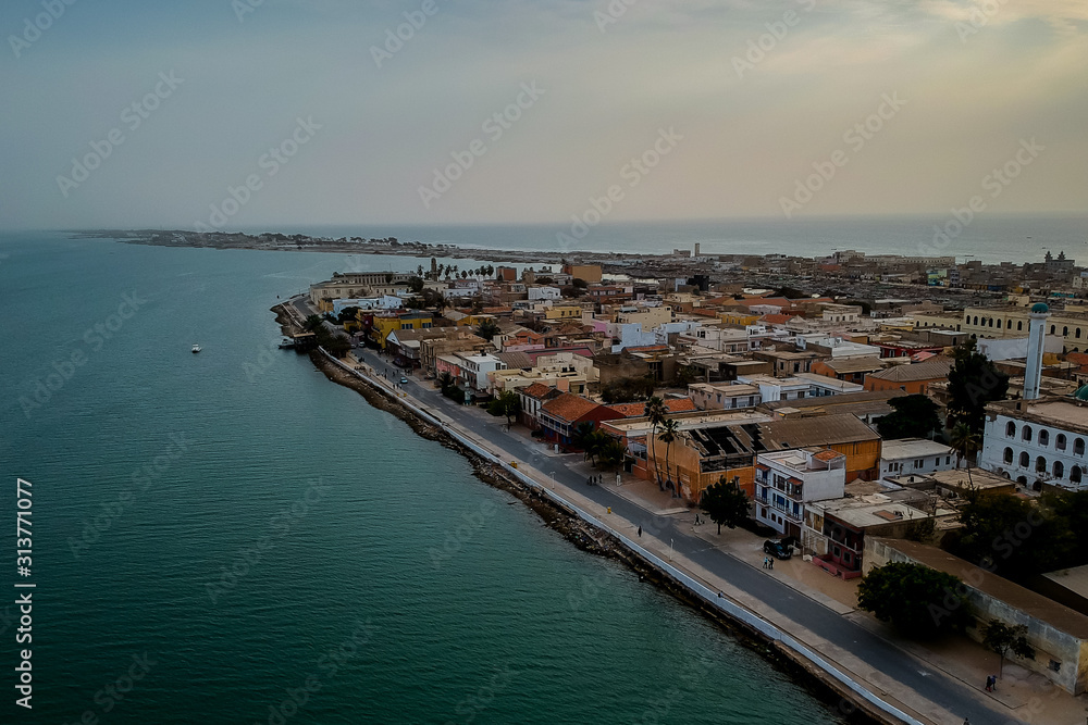 Aerial panorama of Sant Louis, a unesco heritage city in northern Senegal. View from Senegal river towards the old colonial city and fisherman island.
