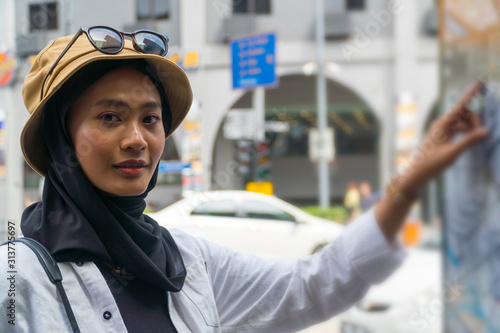 Photography Travel Concept, Muslim Tourist Couple at Kuala Lumpur