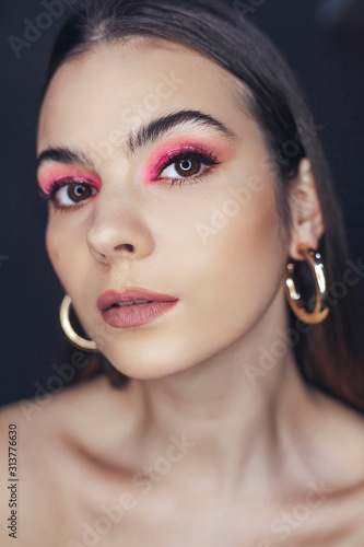 Beautiful woman with pink makeup portrait