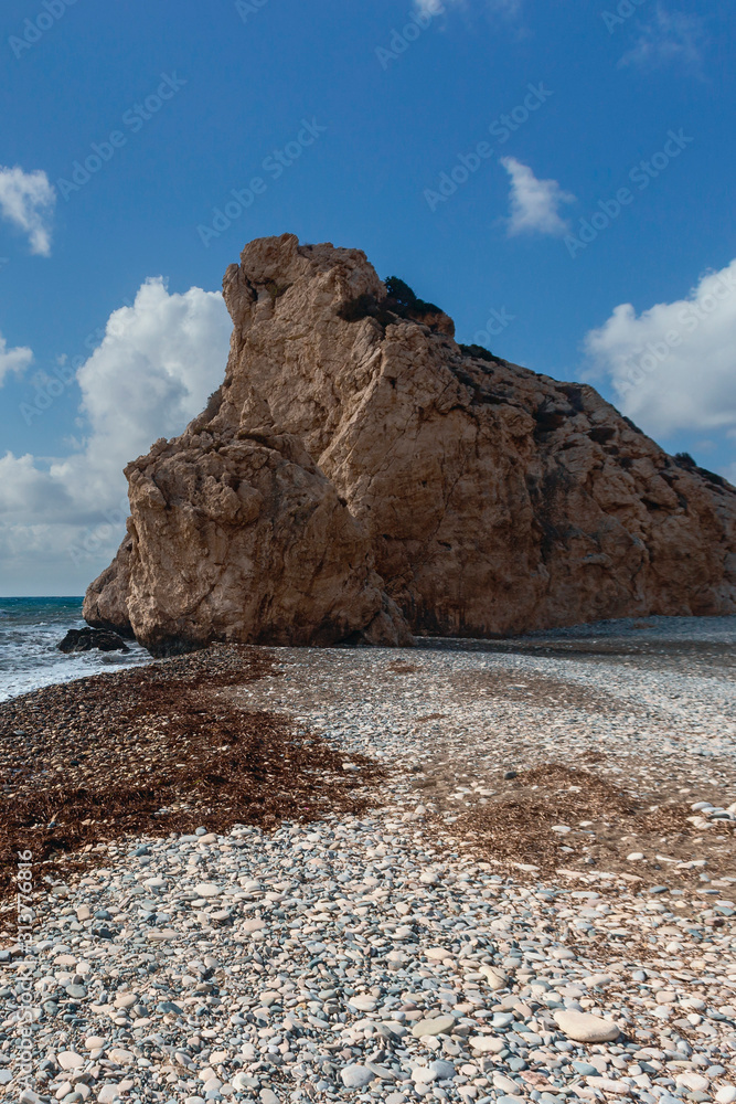 rocky beach of Venus on the Greek island of Cyprus against the backdrop of cliffs and blue sky